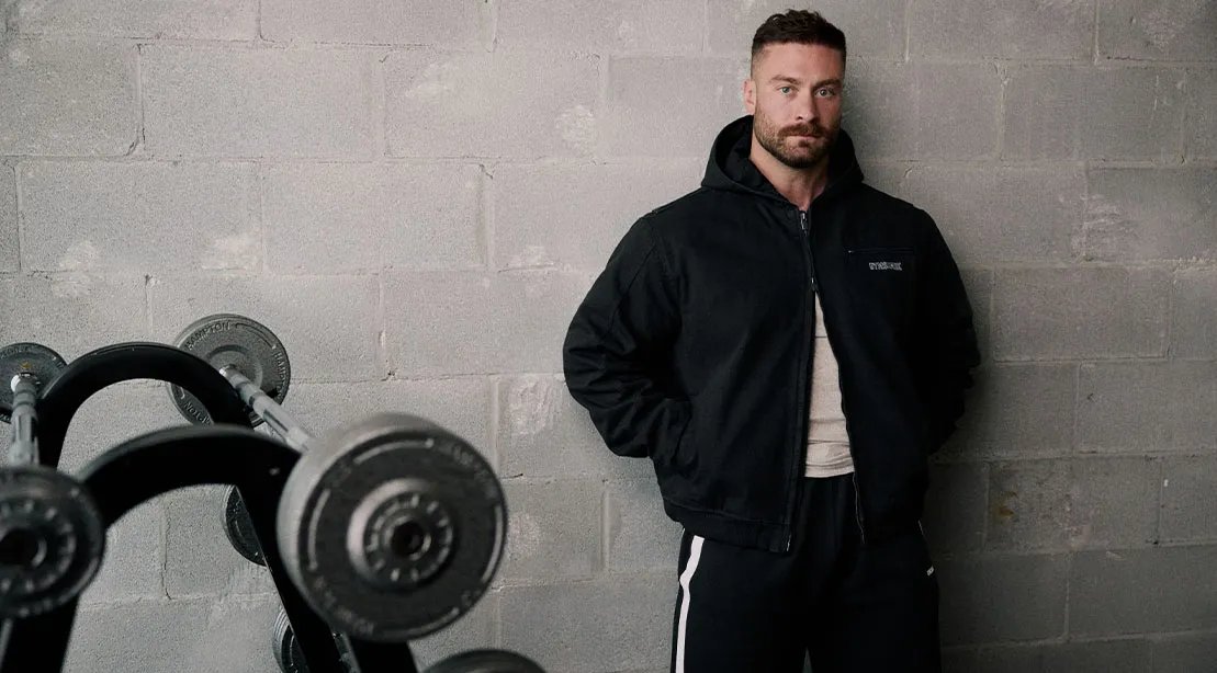 Bodybuilder Chris Bumstead wearing clothes from his collection from GymShark