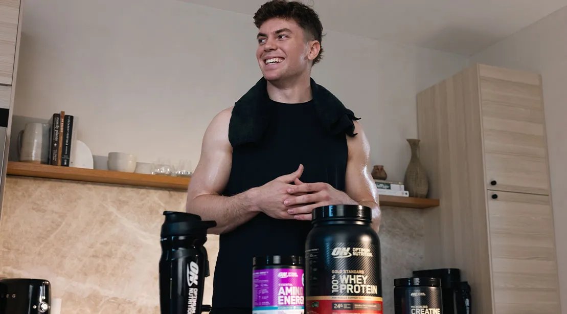 Cooper Dejean at home taking his supplements