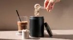 Health conscious person adding collagen and whey protein together for a healthier protein shake