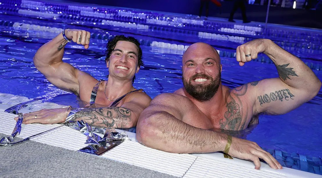 Mitchell Hooper in the pool flexing his biceps
